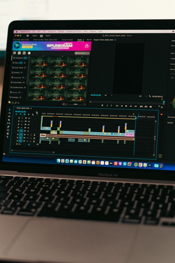 ours-journey Close-up of video editing software on a MacBook Air screen, showcasing a digital workspace.