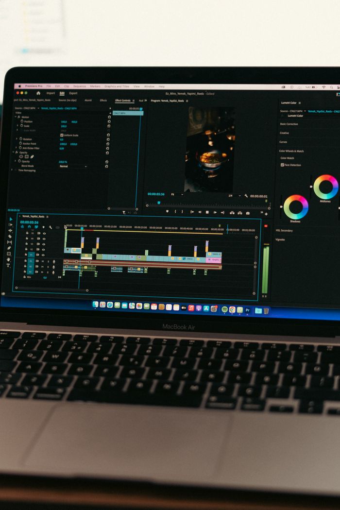 why-choose-us MacBook Air displaying video editing software interface, ideal for technology and digital content themes.