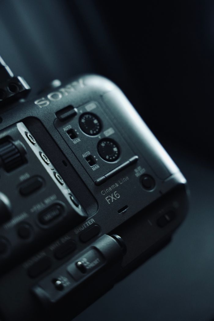 about-img Detailed view of a cinema camera with focus on dials and controls, capturing the intricate design.